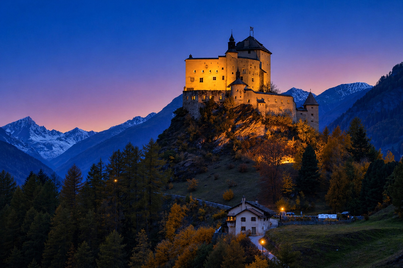 Illuminated castle in the Alps